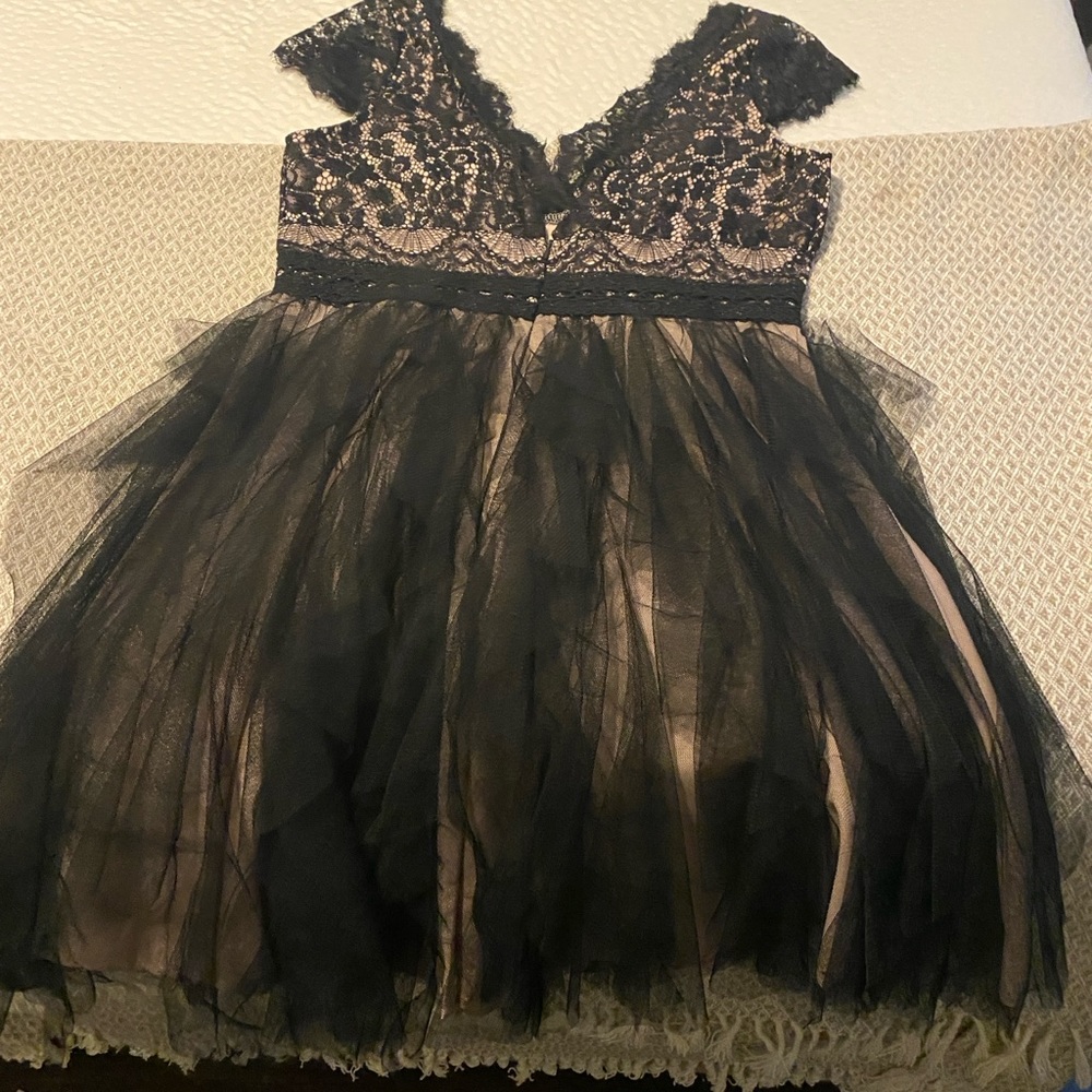 Bought for a wedding but decided neck line was too low- cute with cowboy boots